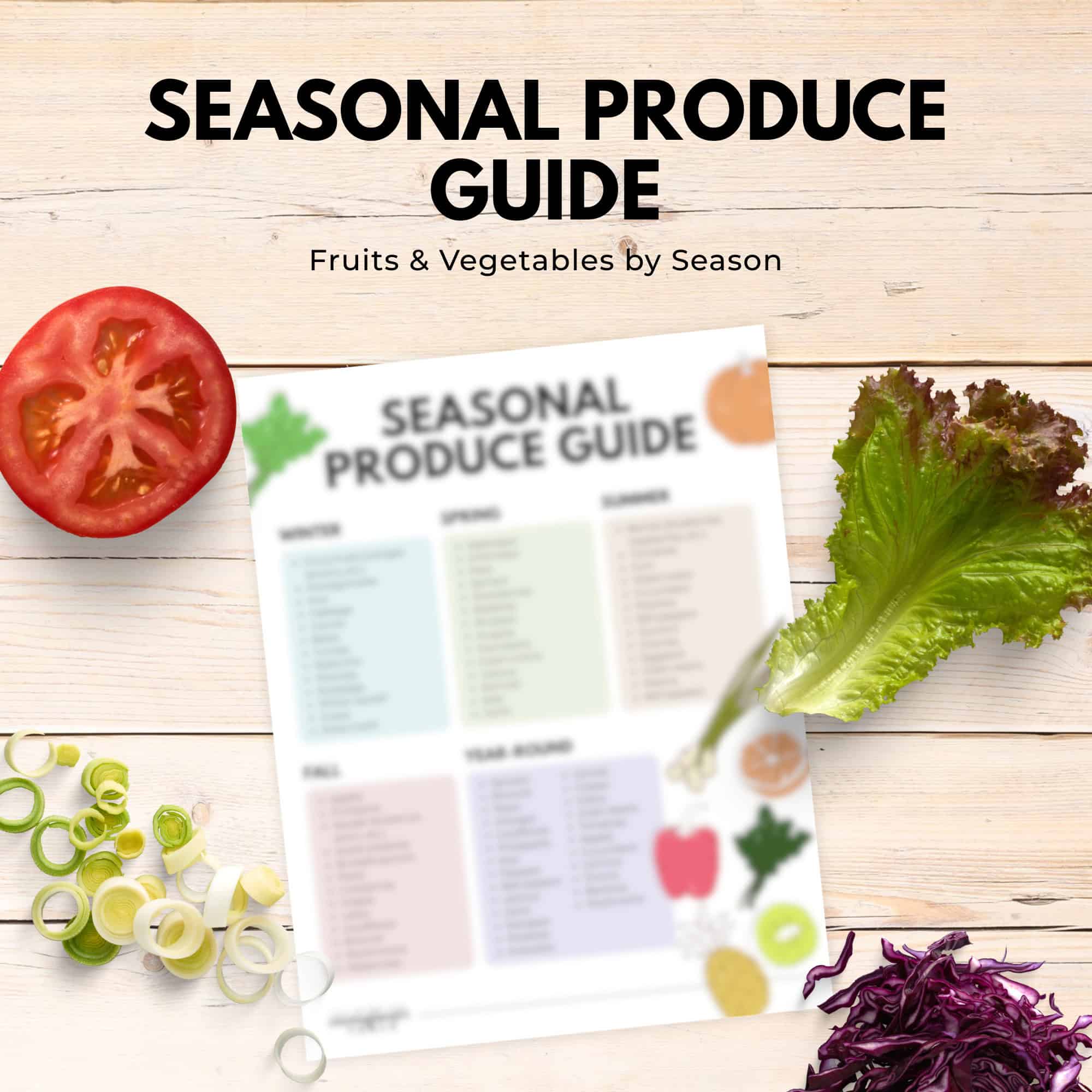 Seasonal produce guide sheet from the immigrantstable shop, surrounded by sliced tomato, lettuce, leeks, and shredded purple cabbage.
