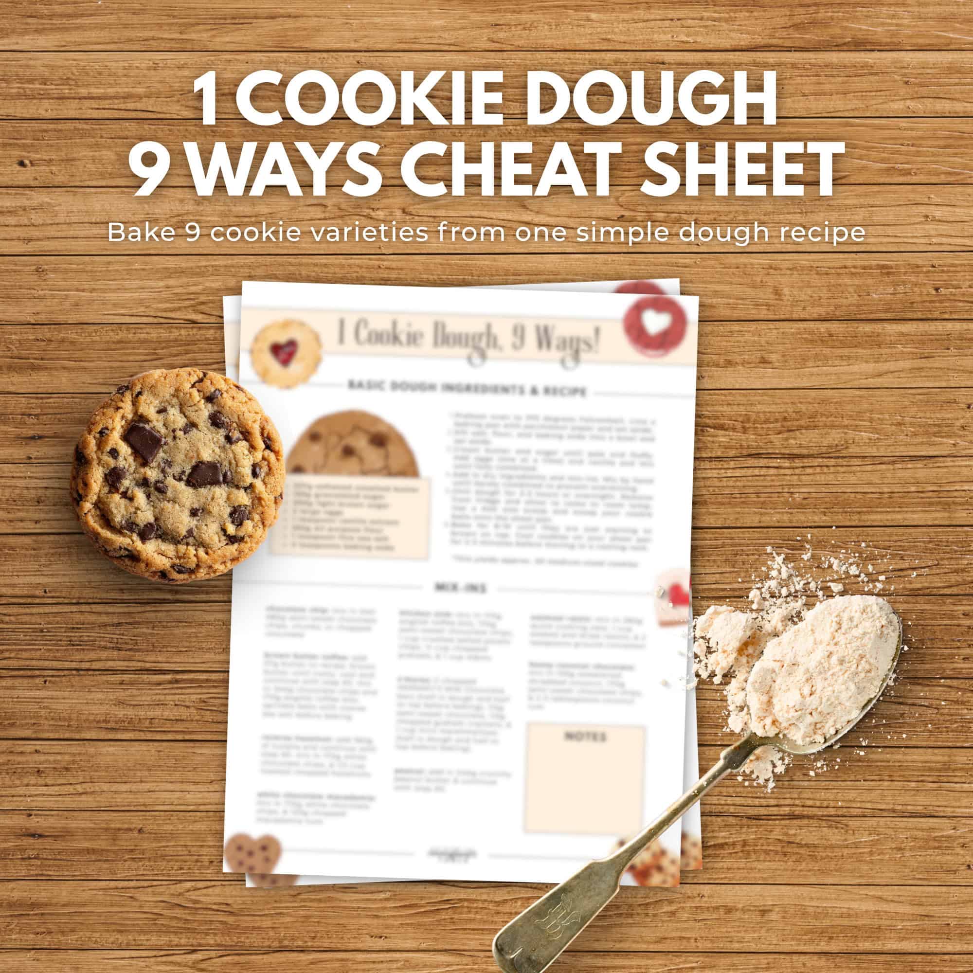 Overhead view of a cookie, a spoonful of flour, and an immigrantstable shop cookie recipe cheat sheet on a wooden table.