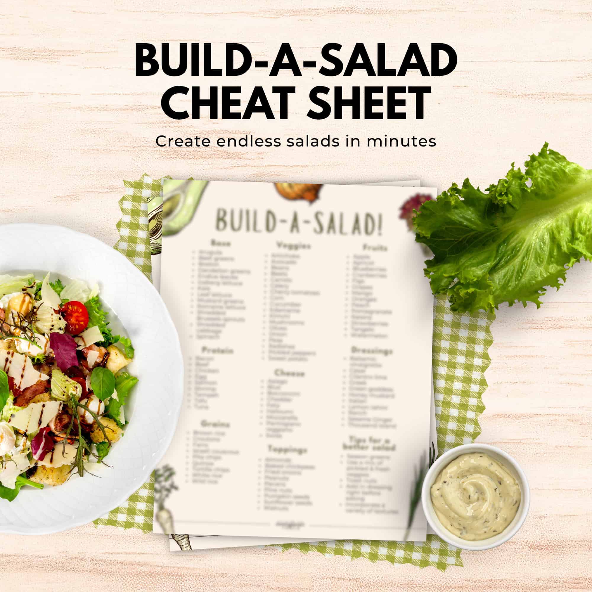 A salad bowl, lettuce, dressing, and a Build-a-Salad cheat sheet from the immigrantstable shop rest on a green checkered cloth.