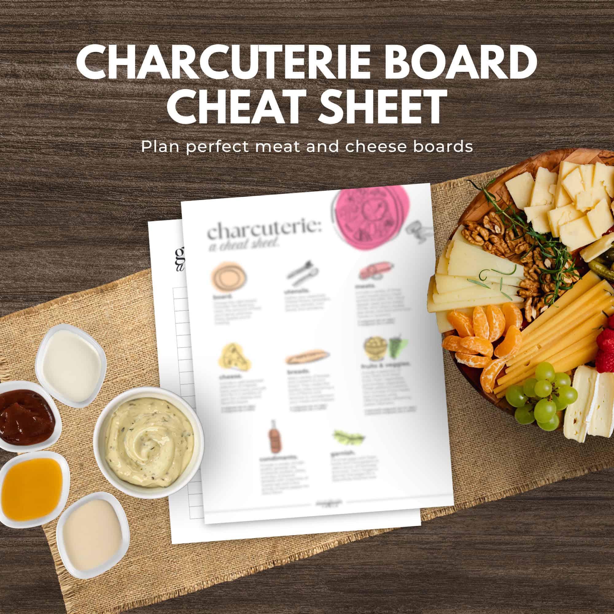 Charcuterie board with meats, cheeses, fruits, dips, and a "cheat sheet" guide on a wooden table-discover unique hosting essentials from the immigrantstable shop.