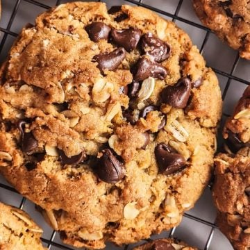 Close-up of chocolate chip oatmeal cookies on a cooling rack.