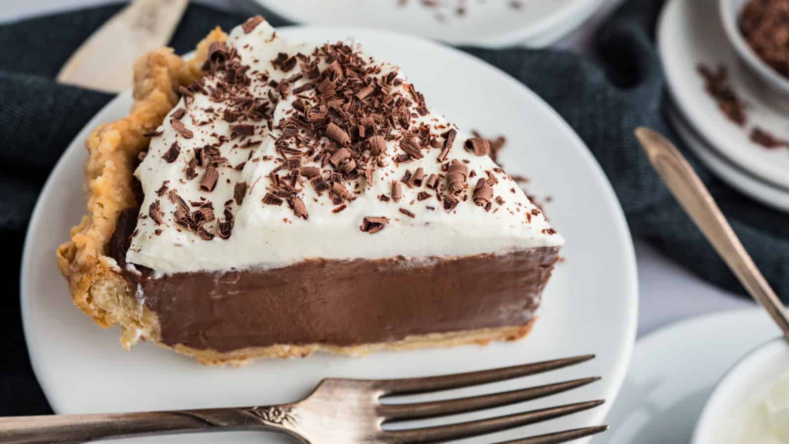 Chocolate cream pie filled with rich chocolate custard and topped with whipped cream.