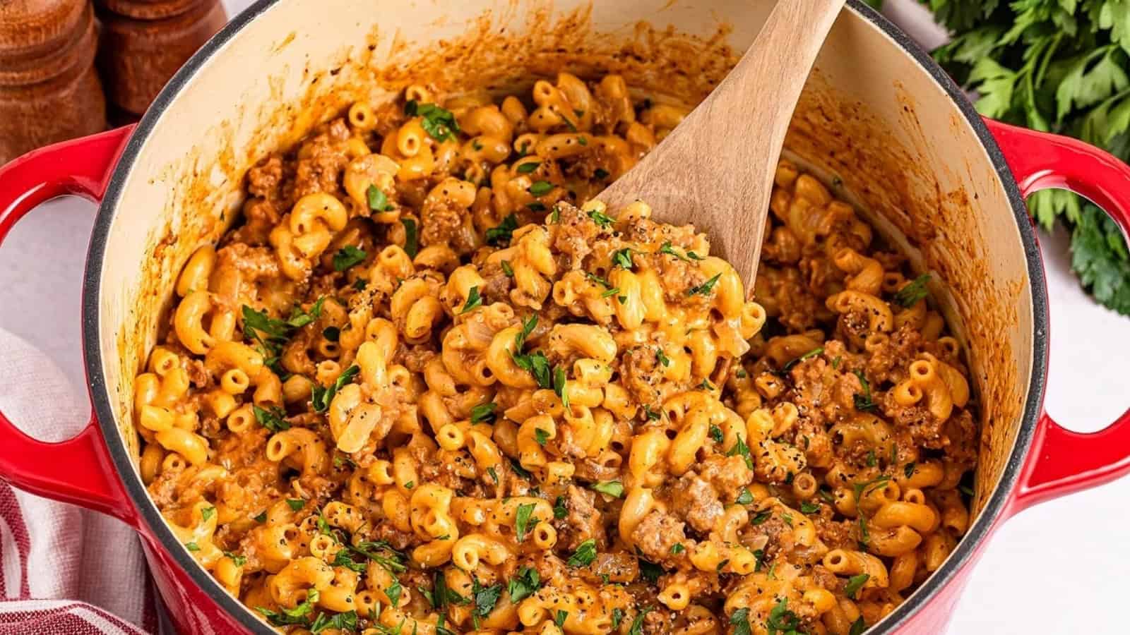 Homemade hamburger helper with ground beef and cheesy pasta in a pan.