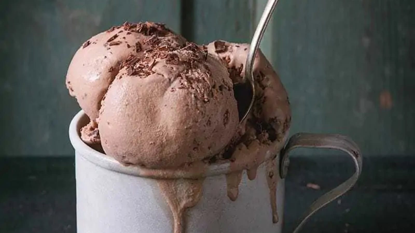 Chocolate Mason Jar Ice Cream overflowing a tin mug and dripping over.