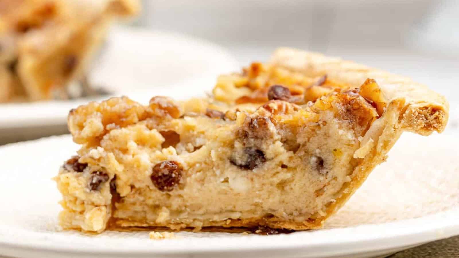 Sour cream raisin pie filled with raisins in a sweet and tangy custard.