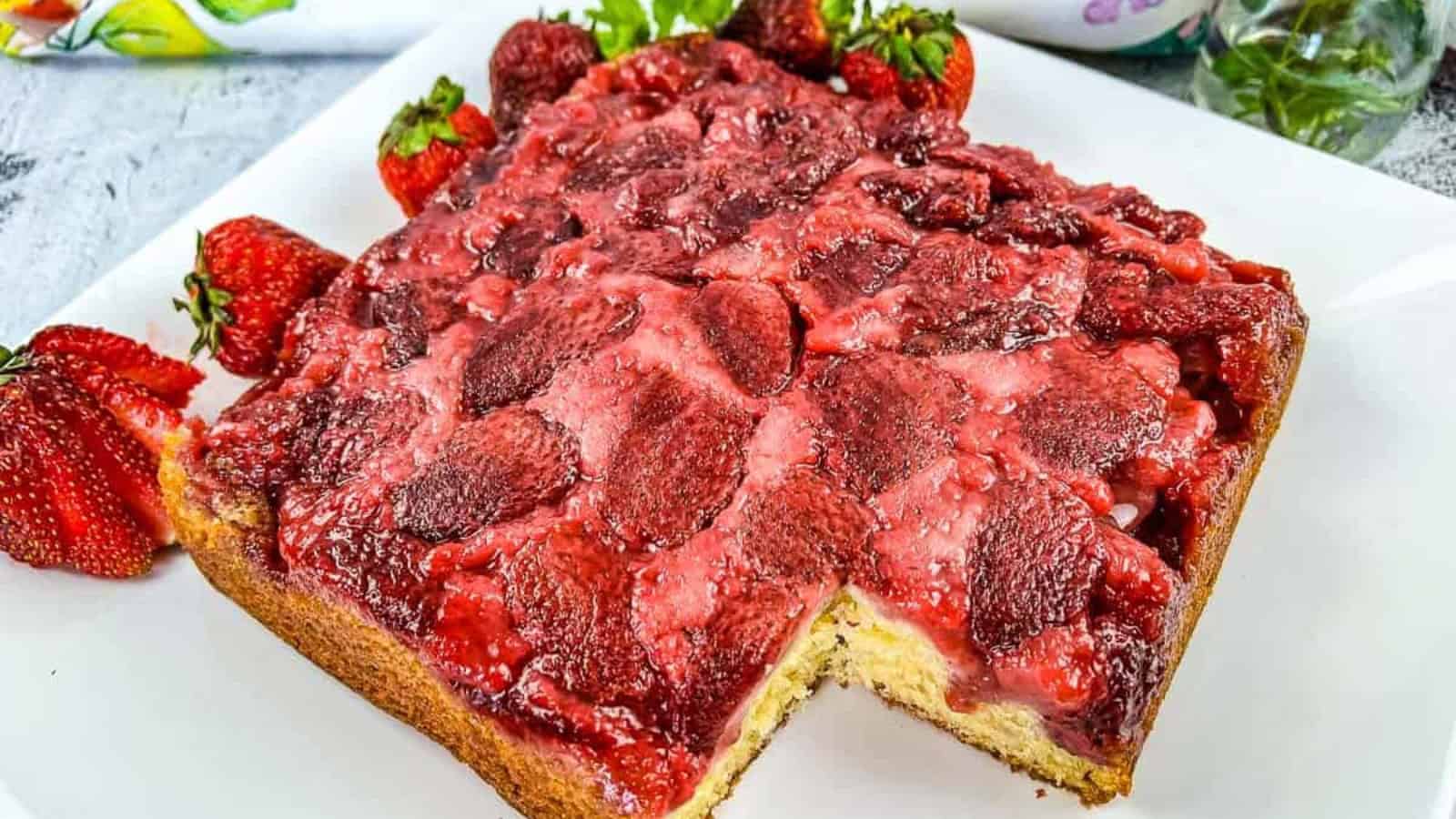 Strawberry Upside Down Cake with a slice missing.