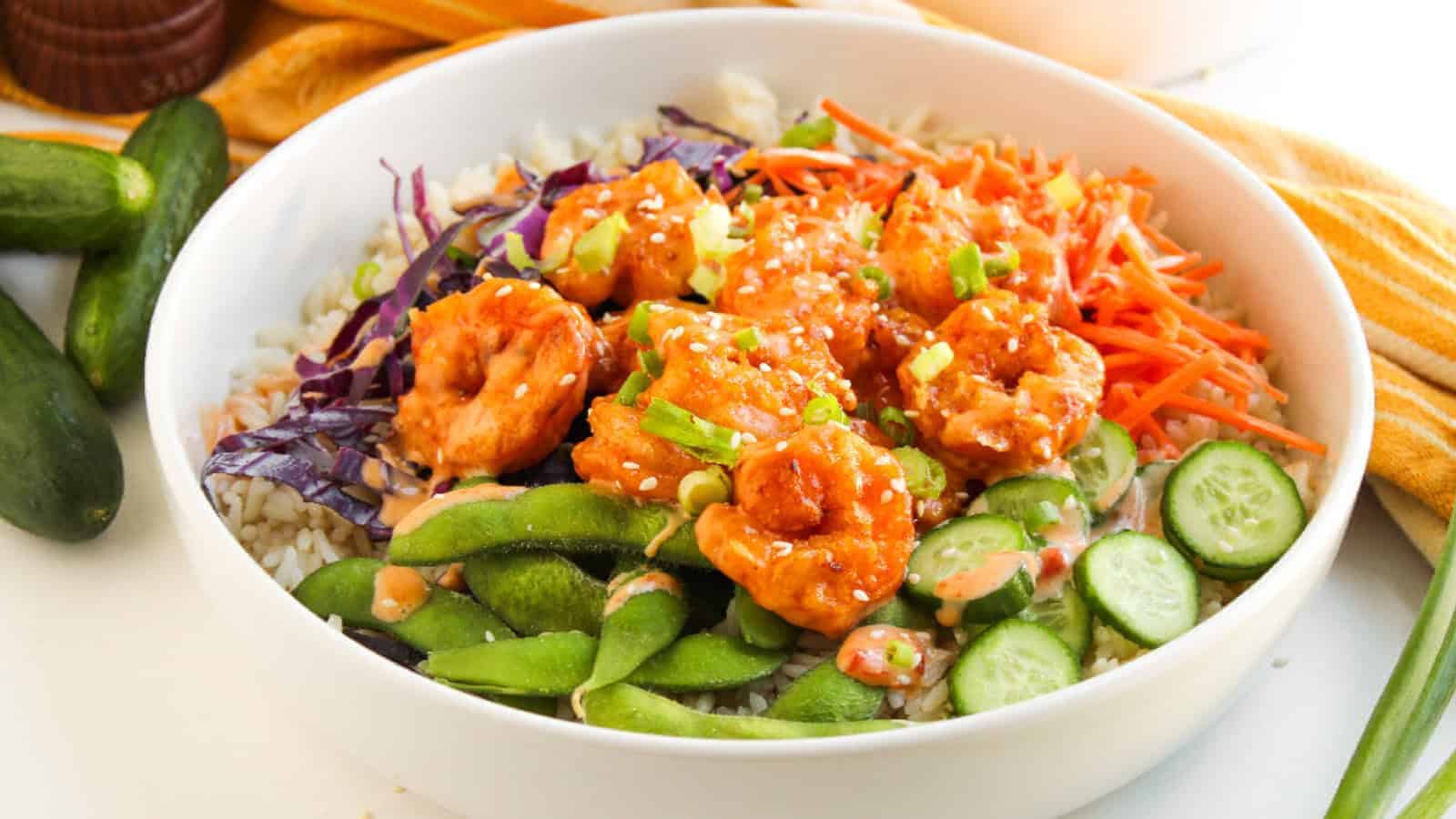 Bang bang shrimp bowl with crispy shrimp, rice, and a creamy spicy sauce.