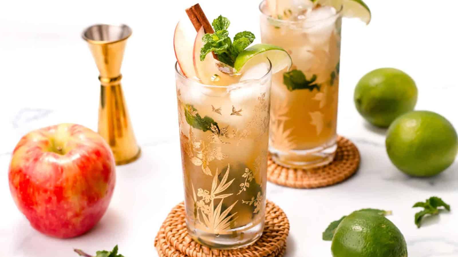 Apple cider mojito served with fresh mint, lime, and apple slices.