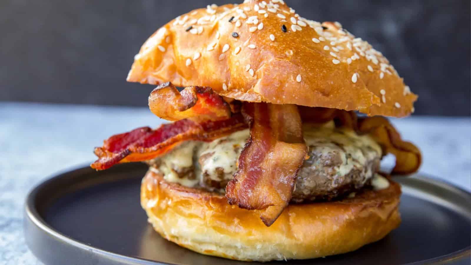 Bacon blue cheese burger topped with crispy bacon and blue cheese crumbles.