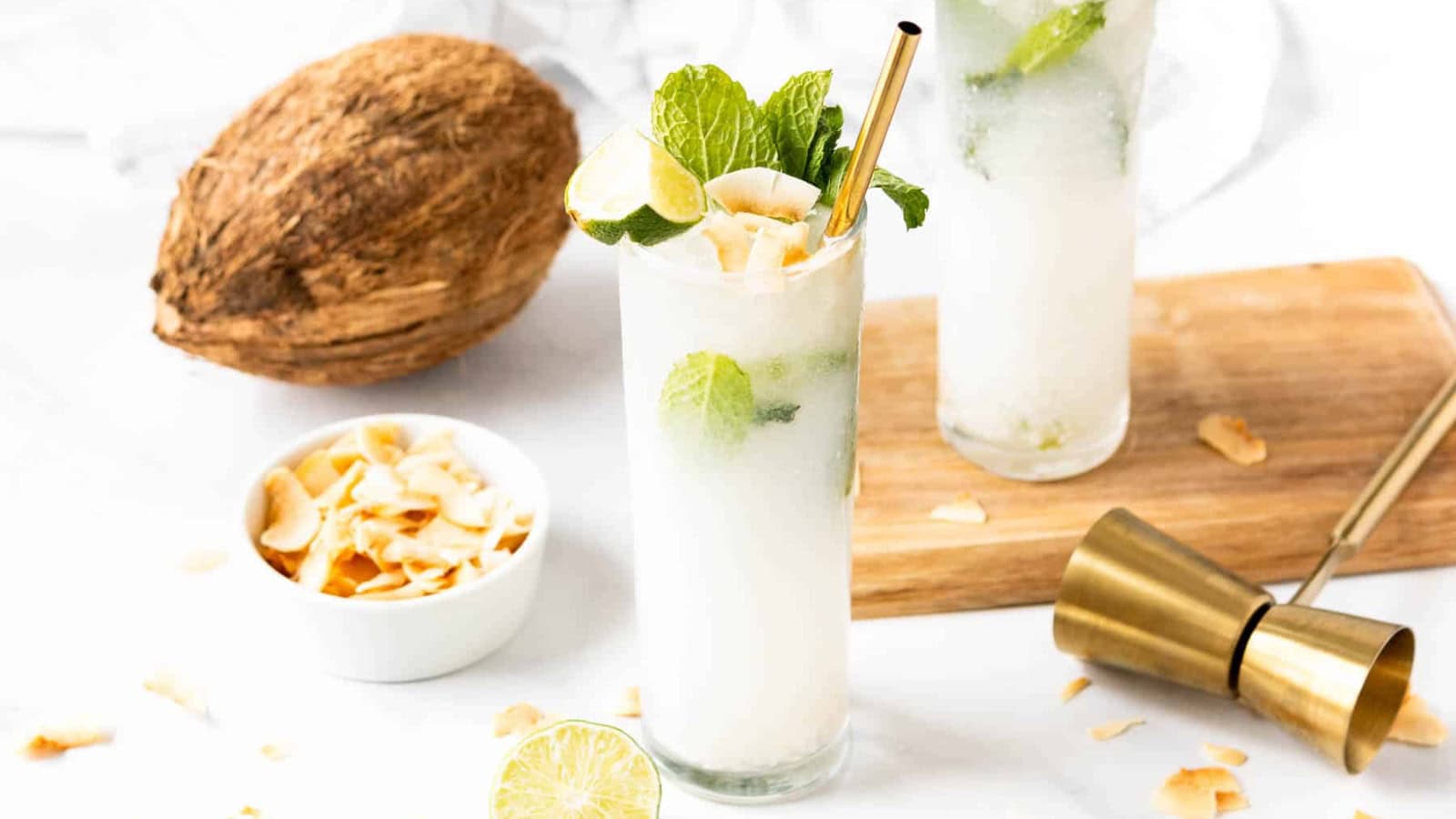 Coconut mojito garnished with fresh mint and lime.