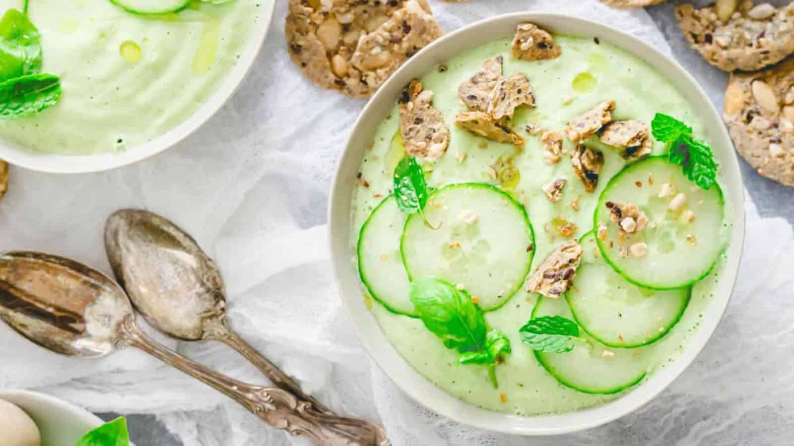 Chilled cucumber gazpacho topped with diced cucumber and fresh herbs.
