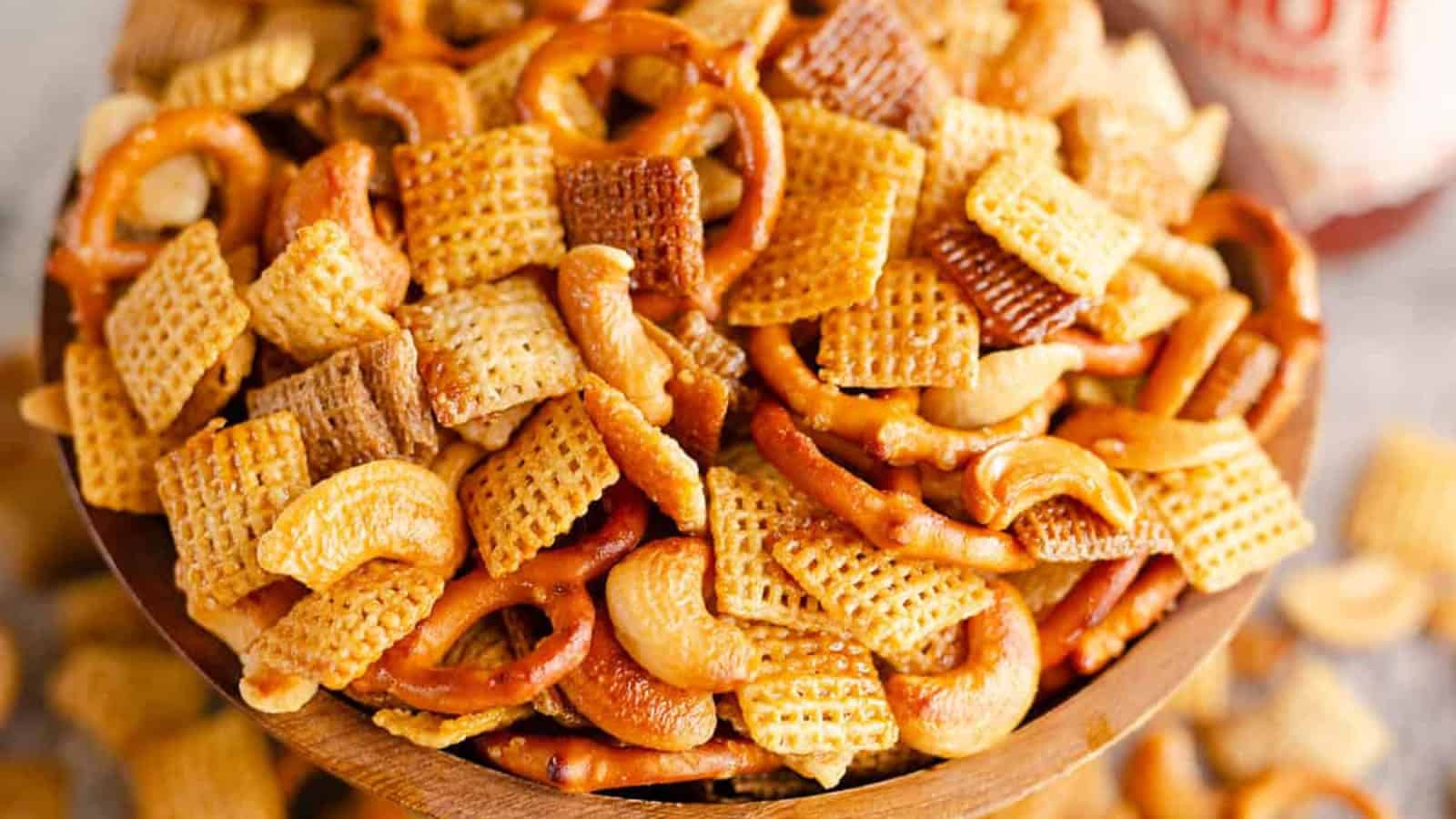 Hot honey snack mix with pretzels, cereal, and a sweet and spicy glaze.