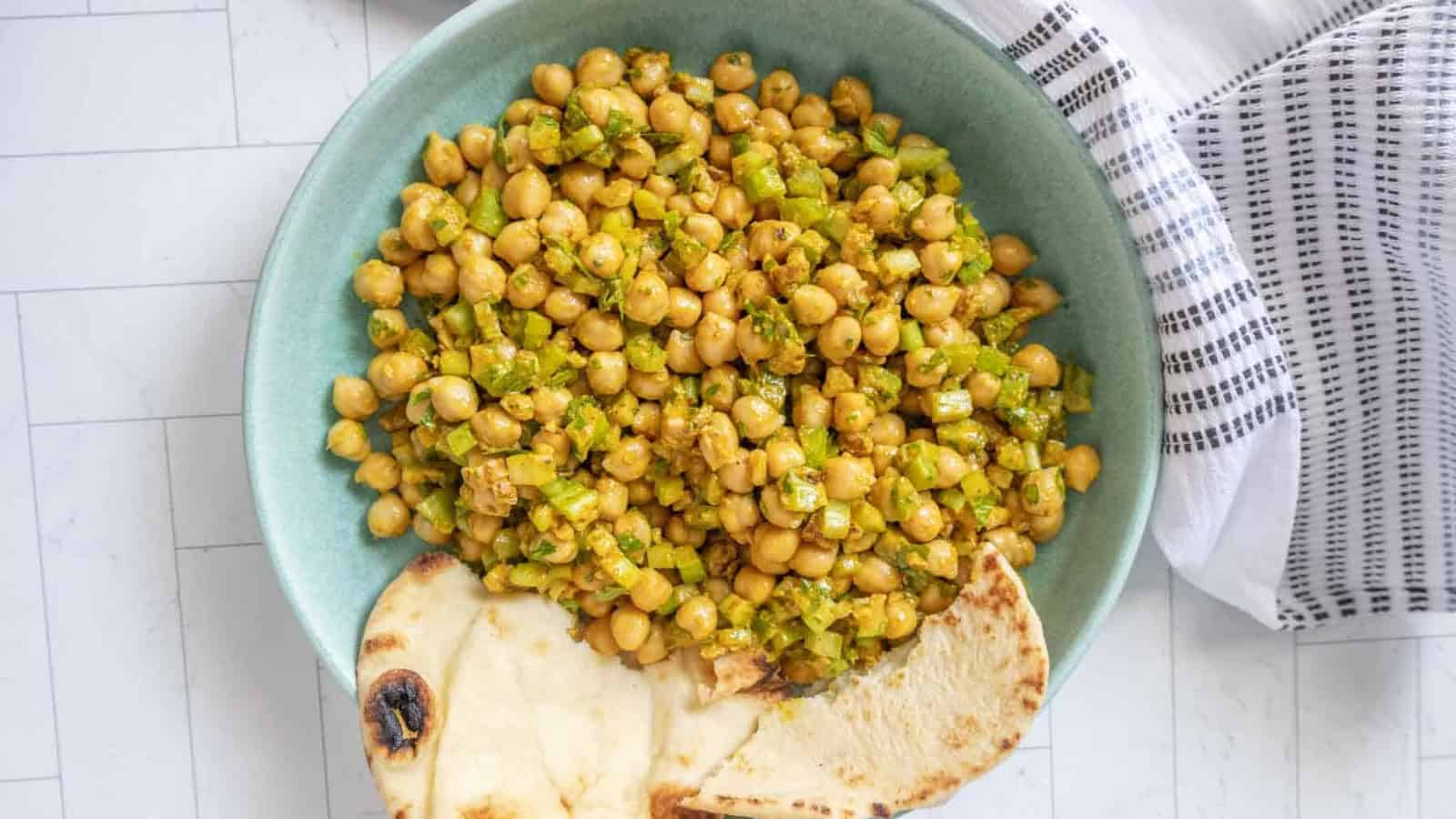 Chickpea salad with tomatoes, cucumber, red onion, and fresh herbs.