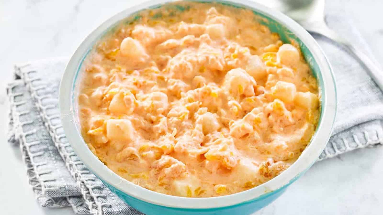 Orange cottage cheese Jell-O salad with mandarin oranges and whipped topping.