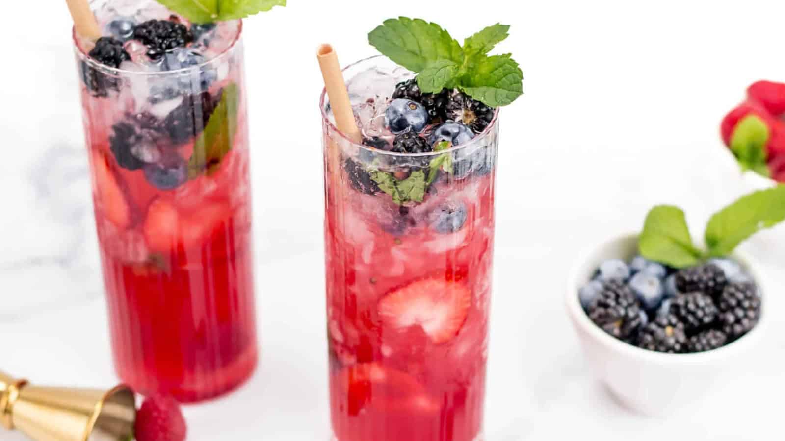 Red, white, and blue mojito with mixed berries, mint, and lime.
