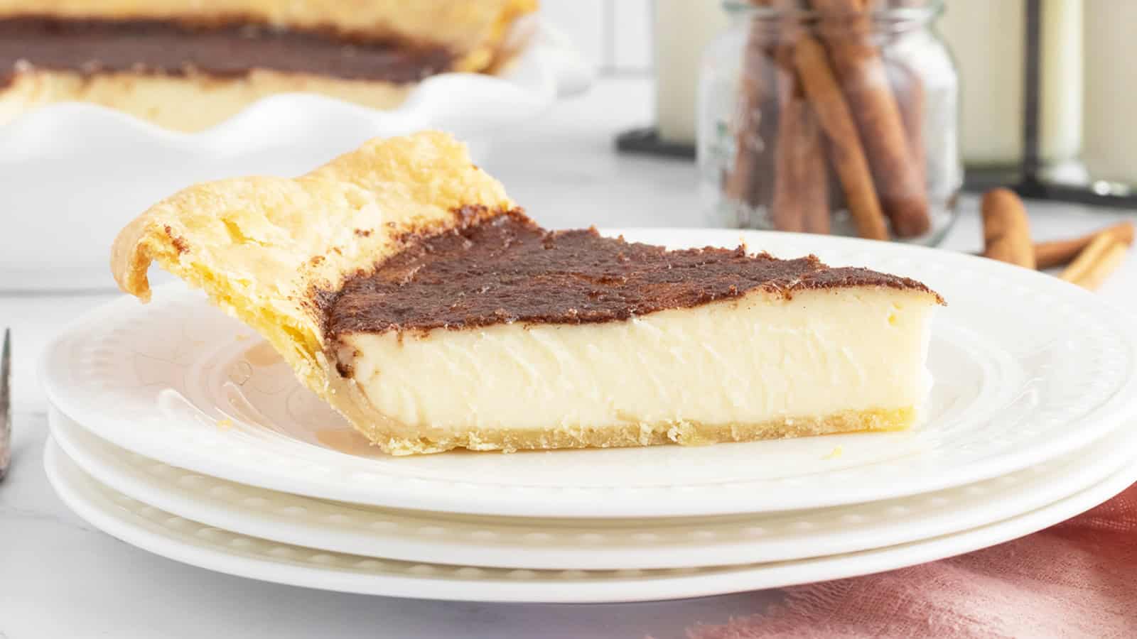 Sugar cream pie with a smooth custard filling and cinnamon sprinkled on top.